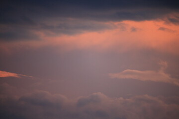 beautiful cloudy sunset creating pink and orange clouds.