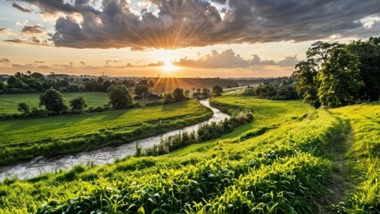 Obraz premium a lush green field with a river in the distance