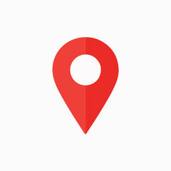 A red location pin icon. The pin is designed with a rounded top, resembling a location marker, and a pointed bottom, indicating direction. It is set against a white background, making the red color