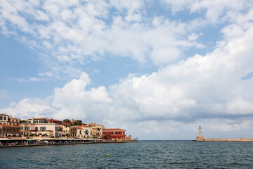 Old venetian harbor of Chania with lighthouse, Chania, Crete, Greece