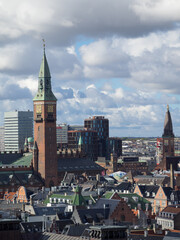 Copenhagen City Hall tower over the city roofs seen from Christiansborg Palace tower