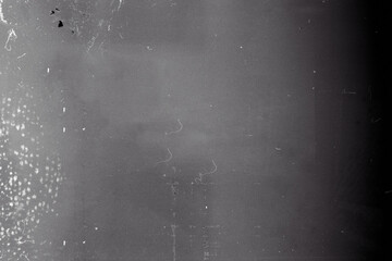 Blank grained film strip texture background with heavy grain, dust and fingerprint