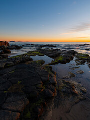 Layer of rock formation on the beach shore.
