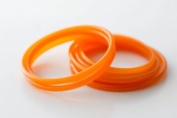 Naklejka premium Two orange rings with a white background
