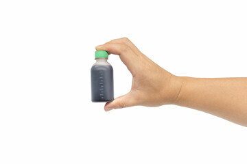 Hand holding a plastic bottle of Chinese medicine potion on white background