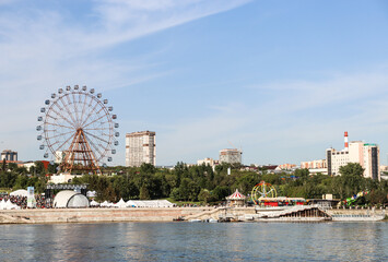 Novosibirsk, Novosibirsk region, Russian Federation - June 01 2024. Ferris wheel on Mikhailovskaya embankment