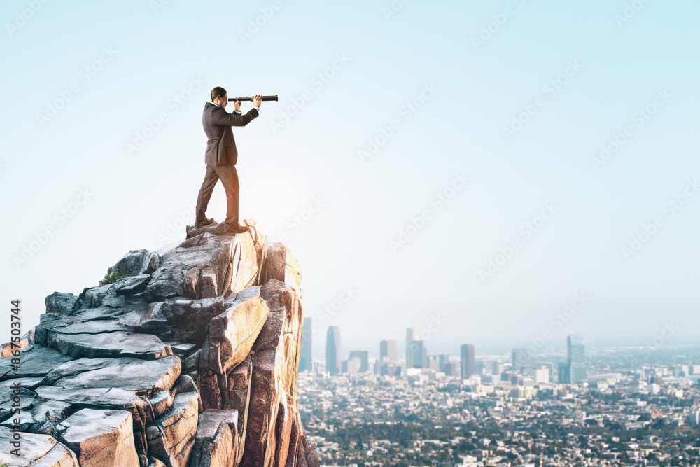 Poster a businessman standing on a rocky peak using a telescope overlooking a cityscape, symbolizing vision
