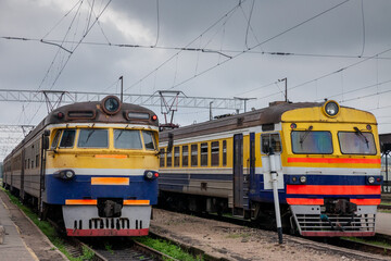 Obraz premium PIcture of trains ready for departure in Riga train station belonging to Latvian Railways.This image depicts old Soviet suburban electric EMU trains ready for departure at Riga train station. The vint