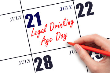 July 21. Hand writing text Legal Drinking Age Day on calendar date. Save the date.