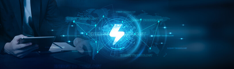 Businessman using laptop and analyzing data with innovative energy technology growth on renewable energy, solar power, wind power, smart grids, and sustainable development on global network.