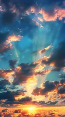 Fototapeta premium Morning sunrise with dramatic sky, blue and orange sun rays illuminating clouds, hopeful nature background