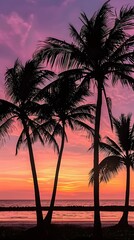 Palm trees silhouetted against a vibrant sunset on a beach, capturing the tranquility and beauty of a tropical vacation