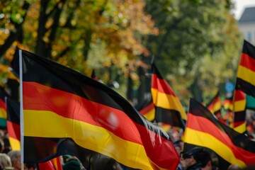 Naklejka premium German Flag Waving in a Crowd at a Parade