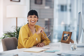 Business woman, notebook and computer in office for job, company and planning with confident smile....