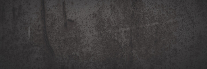 Old rusted metal texture. Rusty iron wall. Rough faded metal surface with spots, noise and grain. Dark wide panoramic background for grunge design. Shaded vintage texture with vignette.