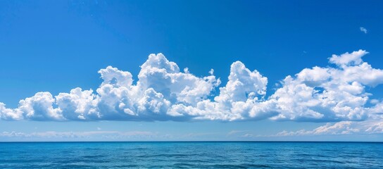 Fluffy White Clouds Against Clear Blue Sky