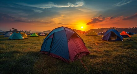 Camping Tents in a Field at Sunset