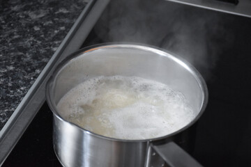 Cooking white rice in a saucepan