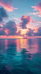 Obraz premium Serene Maldives sunset on the Indian Ocean, with vibrant colors in the sky and tranquil blue waters