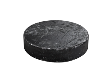 Close-up of a black hockey puck isolated on a white background. Ideal for sports equipment, ice hockey, or competitive sports imagery.