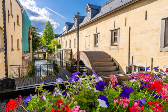 Valkenburg, The Netherlands - June 23 2024 - Watermill in the River Geul flowing through the city center