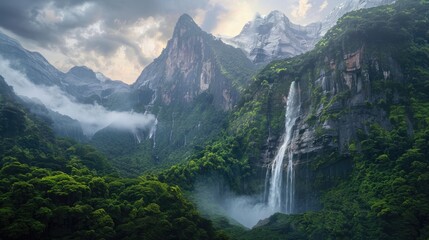 Towering mountains with dense green forests and a breathtaking waterfall.