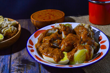 Siomay are steamed fish and vegetable dumplings served with peanut sauce.  Traditionally made from mackerel fish.  Siomay is a typical Bandung city food.