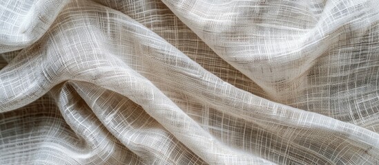 Texture of light linen fiber fabric on a woven white surface