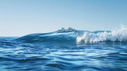Ocean wave crashing on blue sea under clear sky, nature background. Serenity and tranquility concept
