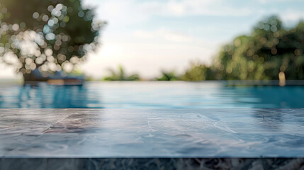 Empty stone table on a blurred swimming pool background, creating an abstract and serene atmosphere.