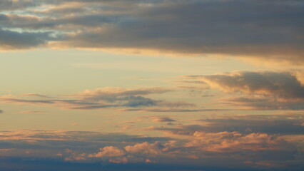 Morning sunrise through clouds. Beautiful sunrise background after rain with clouds. Timelapse.