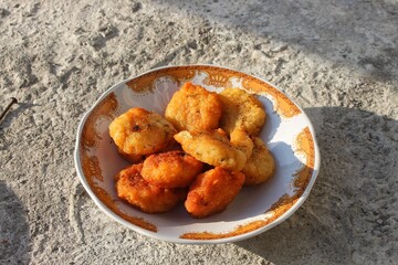 fried food served on a white plate