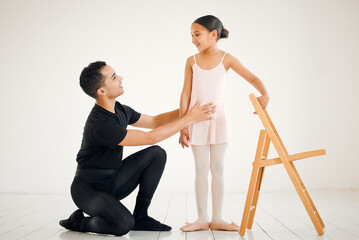 Obraz premium Ballet, support and coach or teacher with student for learning, development and sport in dance studio. Creativity, chair and happy girl or ballerina in theatre for balance, mentor and talent for show