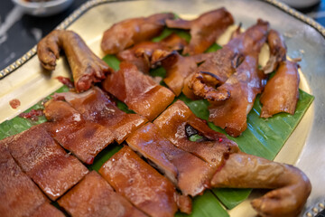 Roasted whole suckling pig served on plate