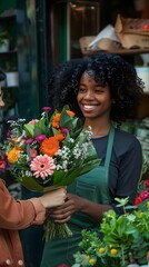 Fototapeta premium Black woman, working in garden center, with customer