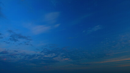 Beautiful sunset with cirrus clouds. Sun shines at level of horizon and warm tones colors. Timelapse.