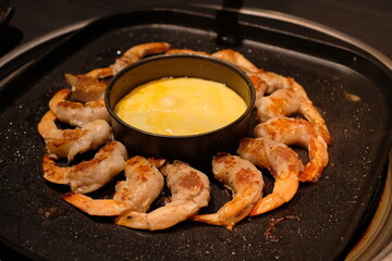 samgyeopsal with shrimp ; sliced pork and shrimp belly cooked on a tabletop grill
