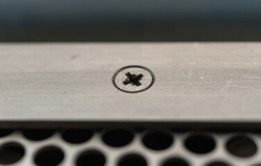 screw with slightly stripped ridges close-up