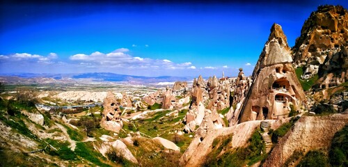 Cappadocia's landscape features ancient cave dwellings, unique rock formations, and fairy chimneys. This Turkish wonder showcases natural geology, ancient civilizations, and exotic travel.