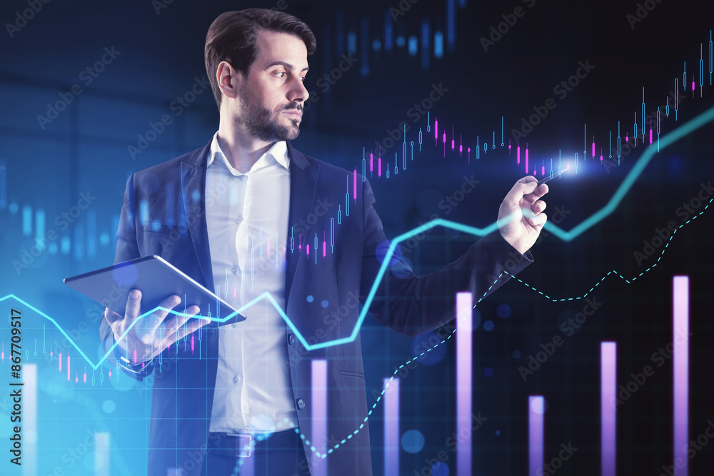 Poster a man in a suit holding a tablet and interacting with glowing financial graphs on a dark blue backgr