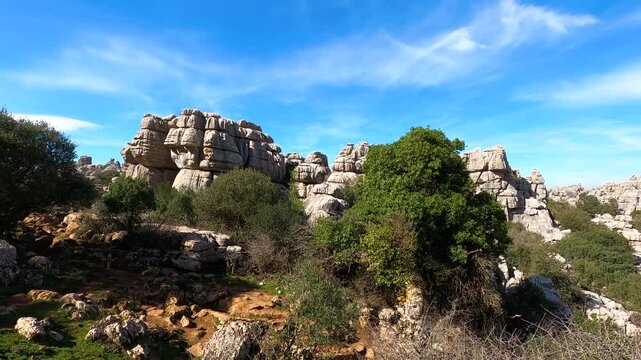 Hiking in the Torcal de Antequerra National Park, limestone rock formations and known for unusual karst landforms in Andalusia, Malaga, Spain.