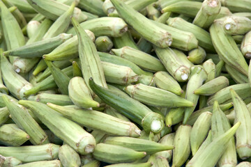 Close up on pile of fresh raw Okra sale at farmers market.. View from above.