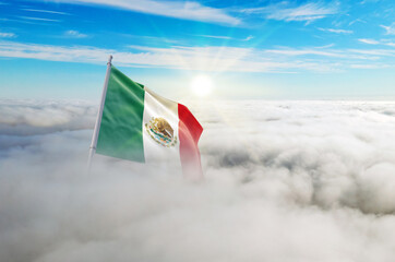 Mexico flag aerial view in beautiful sky with clouds. Top-down drone shot at sunrise or sunset. Aerial bird's eye view of the flag with cloudscape.
