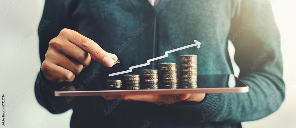 Poster person is holding a tablet with a graph of money on it