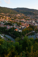 Obraz premium Sunset view of the Miljacka River from the terrace of the Park Princeva Restaurant on the hill above Sarajevo, Bosnia and Herzegovina