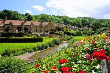 Pretty cottages of the village village of Sandsend with roses, North Yorkshire, England