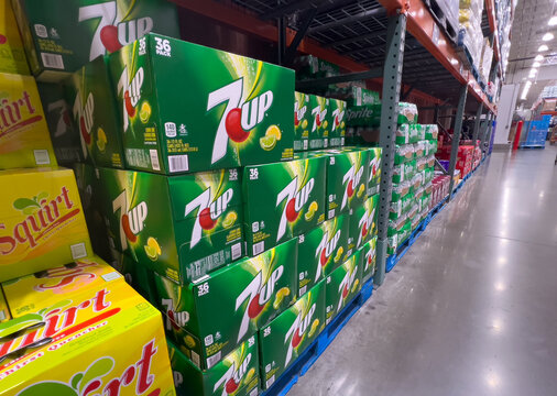 Pallet of Carton boxes of made in USA Seven up 7up brand cans of carbonated sweetened soda for sale at a local wholesale warehouse