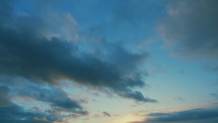 Obraz premium Texture of bright evening sky during sunset. Background of clouds on the burning dawn.