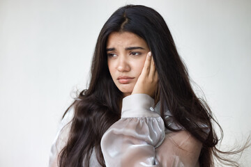 South Asian, Indian woman suffering from toothache, tooth decay, tooth sensitivity, wisdom tooth...