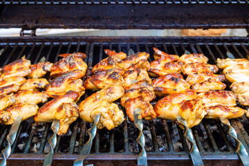 Charcoal BBQ grill at used to grill chicken wings is American cuisine